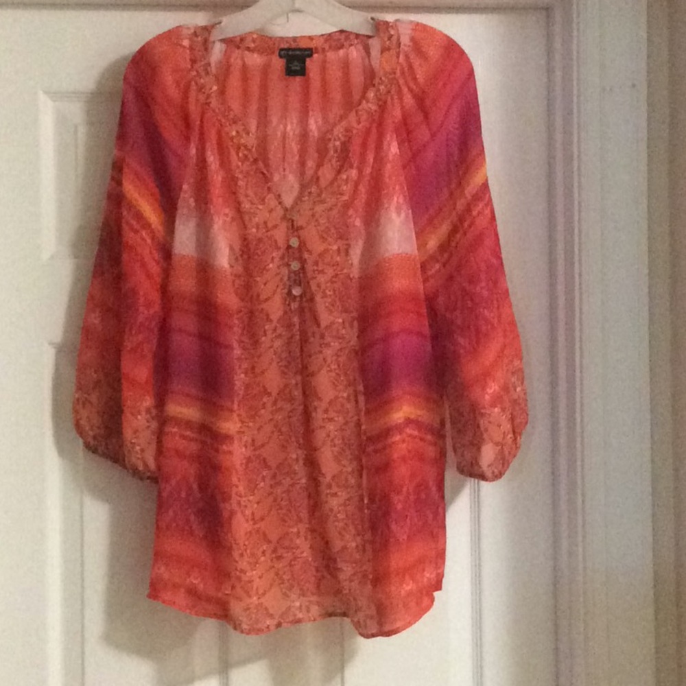 Burnt colored blouse perfect for office.